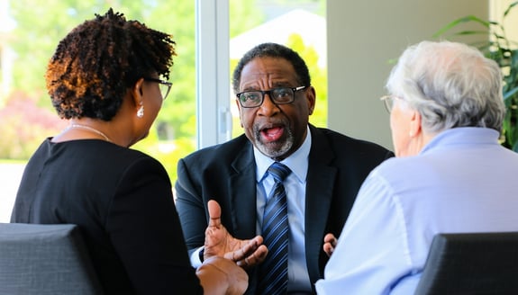 a lawyer explaining something to three HOA senior members-2
