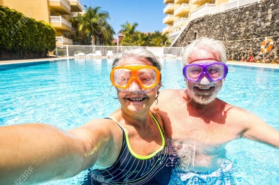 Elderly couple enjoying the pool